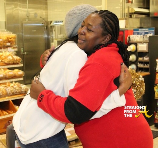 Marlo Hampton embraces recipient of her Simply Giving giveaway.
